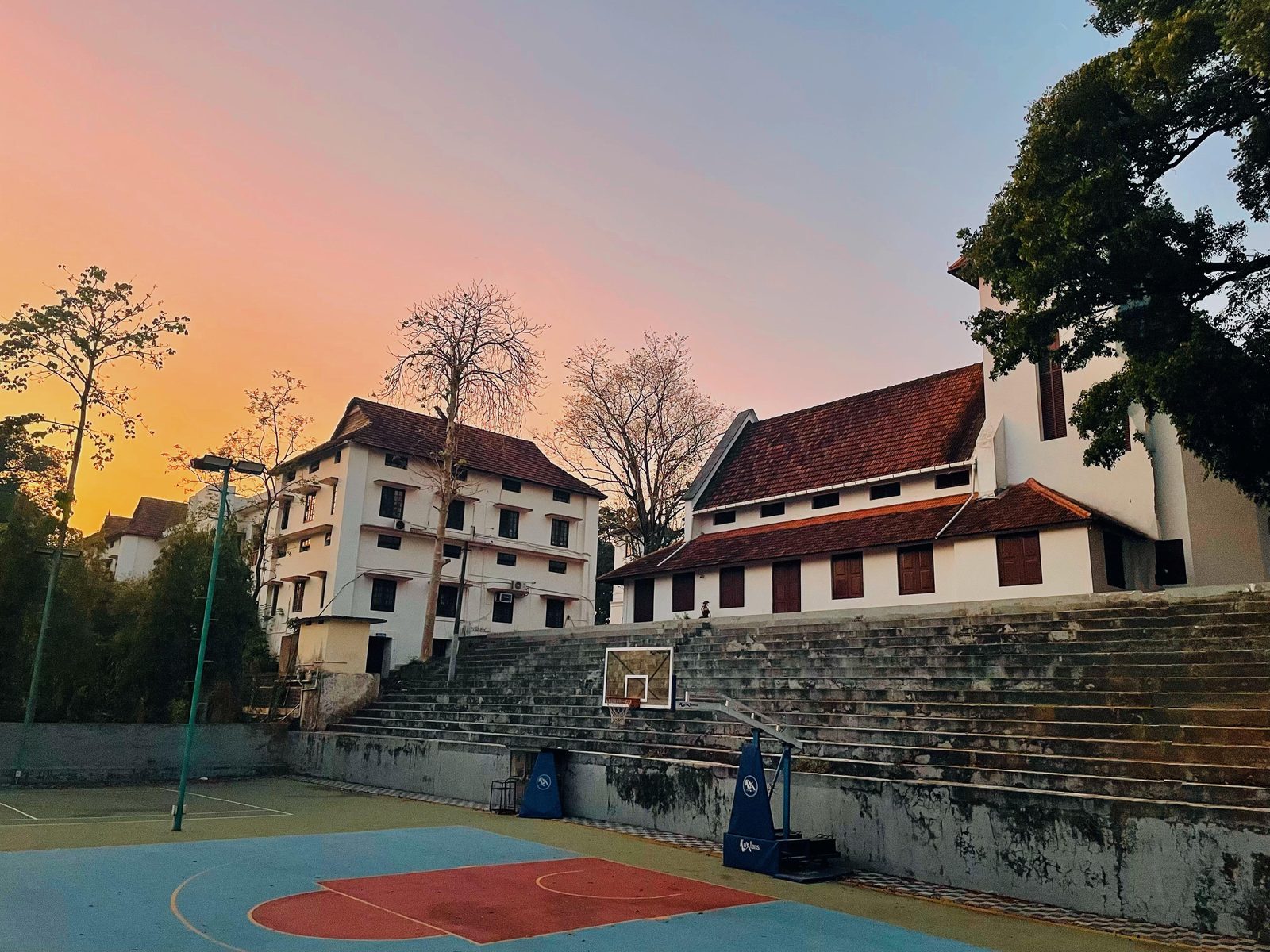 Union Christian College campus at dusk, with the college chapel and playground